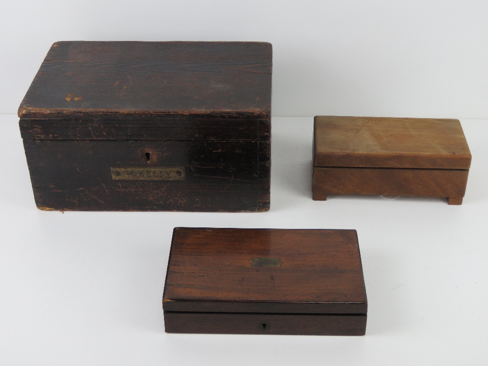 A compass set within fitted wooden box t