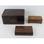 A compass set within fitted wooden box t