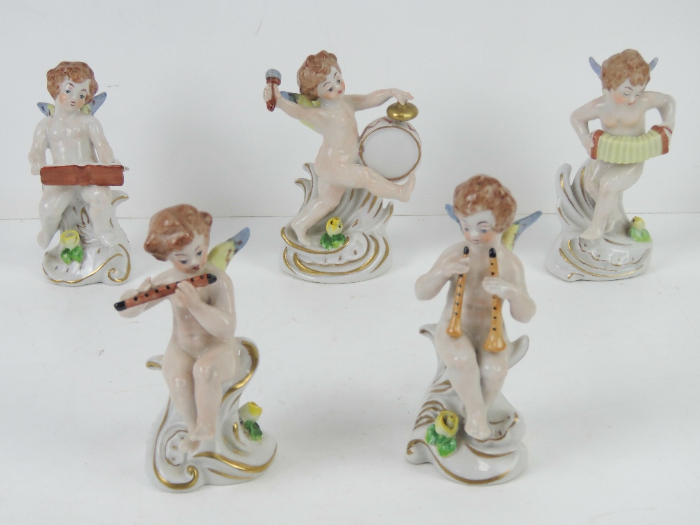 A set of five ceramic angelic musicians,