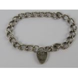 A HM silver curb link chain charm bracel