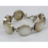 A mother of pearl bracelet having T-bar