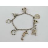 An HM silver charm bracelet having part