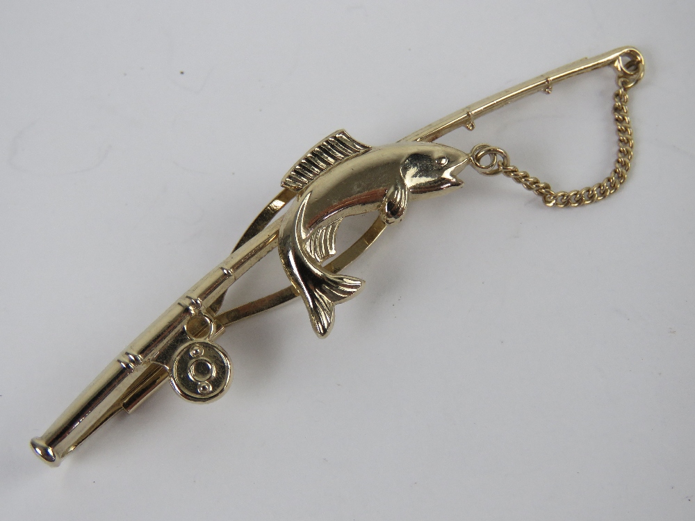 A Stratton tie clip in the form of a fis