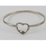 An HM silver bangle having heart design