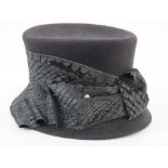 Bailey Tomlin London; a 100% fur felt hat complete with faux pearl hat pins, approx size 7.