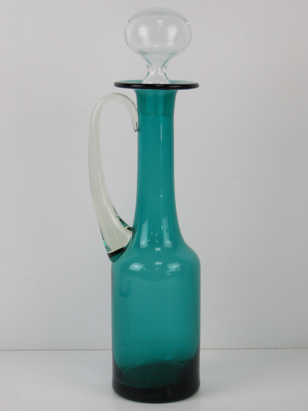 A turquoise and clear glass claret jug s