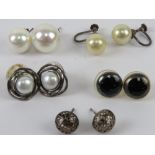 A pair of silver and pearl stud earrings