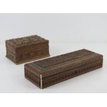 Two carved wooden boxes, 27 x 10cm and 1