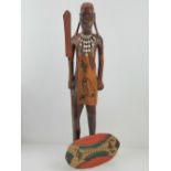 A carved wooden figurine of a tribesman