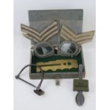 An RAF Officer's small kit box containing cutlery, brass button polishing board, goggles,