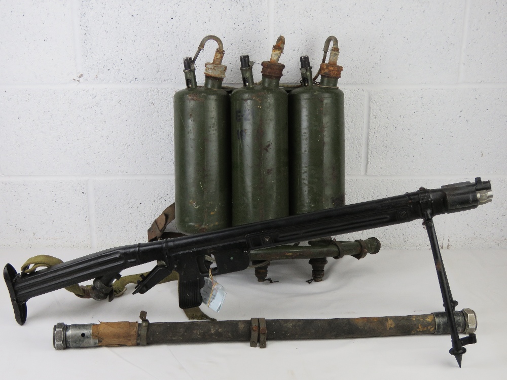 A deactivated LPO-50 flame thrower having moving parts with connector hose and tanks.