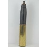 An inert WWI British shrapnel round with case, dated 1916, standing 61cm high.