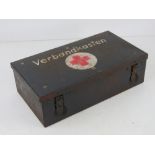 A WWII German medical kit having medical accessories within inc; foot powder, medical arm band,