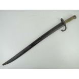 A French 1871 Pattern bayonet having 57.5cm blade, brass grip and hook quillion, with scabbard.