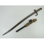 A French 1871 Pattern bayonet, having 57.5cm blade, brass grip and hook quillion.