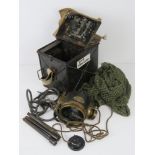 A WWI signal lamp having metal and canvas covered case having clear glass lens with green and red
