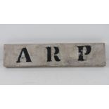 A wooden ARP sign 'found on door behind wall in Northampton'. 35 x 8cm.