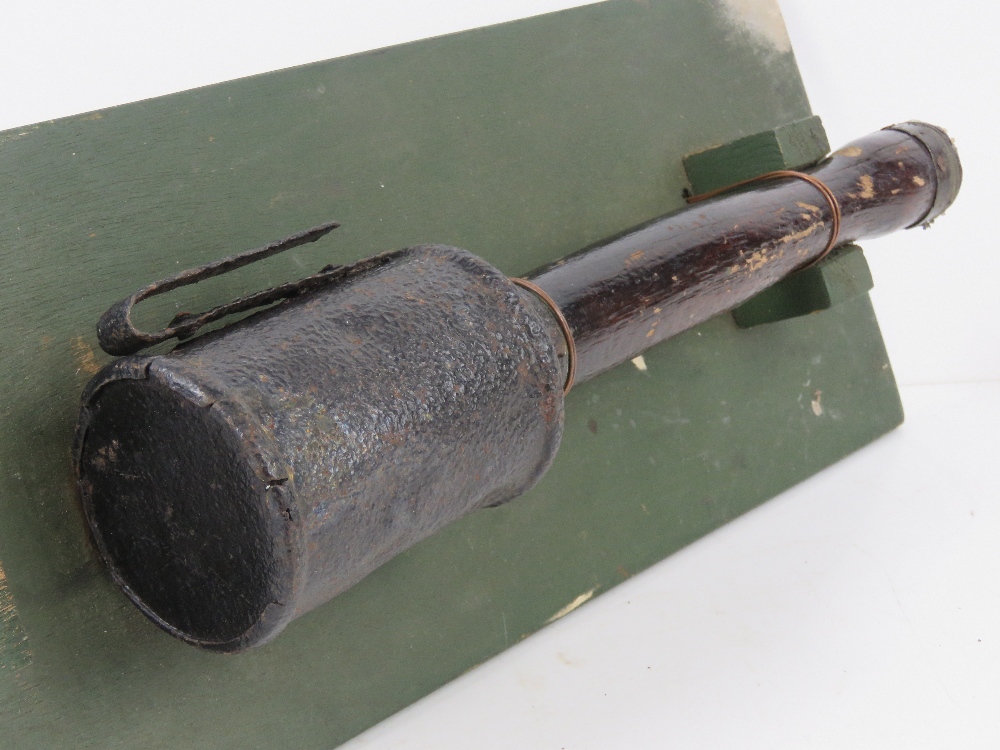 An inert WWI German stick grenade, mounted on board for display purposes, board measuring 42 x 18cm. - Image 3 of 3