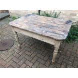 A 19thC pine plank top table having turned legs, drawer deficient, 112 x 74 x 76cm.