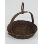 A cast iron swing skillet for an open fire having Swaine mark to base, 8".