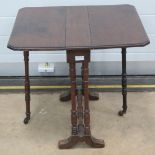 An oak stool having oval top and raised over four square cut legs.