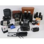 A quantity of assorted cameras and binoculars.