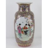 A large Chinese shoulder vase having female figures upon with pink and blue floral decoration and