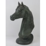 A ceramic sculpture of a horses head, bronzed effect, 39cm high.