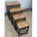 A nest of four 20th century high glass Oriental style tables, approx 51, 46,