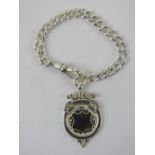 A HM silver Albert chain having clasp and medallion upon, hallmarked throughout, 19.9g.