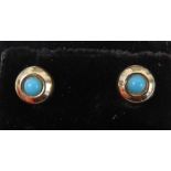 A pair of turquoise stud earrings, no apparent hallmarks, with butterfly backs.