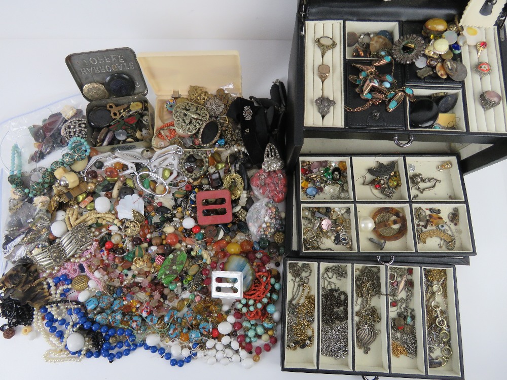 A large black leatherette jewellery box containing a quantity of assorted vintage jewellery,