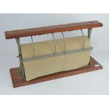 A vintage shop type mahogany wall mounted brown paper dispenser as made by Drayton,