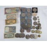 A quantity of Japanese and Indian bank notes, assorted coins and commemorative coins.