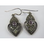 A pair of silver and marcasite earrings,