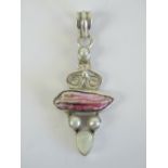 A shell and mother of pearl pendant of abstract form, handmade, stamped 925, 5.5cm in length.