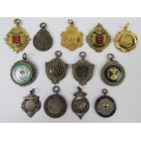 A quantity of assorted sporting medallions including two unengraved silver medallions and one