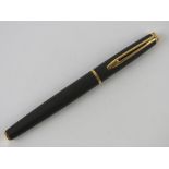 A Waterman fountain pen having original medium nib, in black leather case.