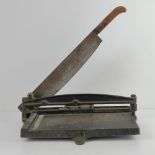 A vintage hinged paper guillotine on cast metal base, c1950s.