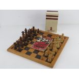 A vintage carved wooden chess set by Staunton in original box,