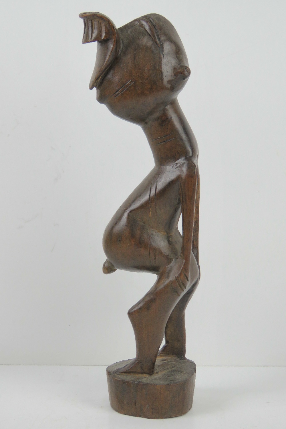 A late 19th / early 20th century carved African fertility figurine standing 31cm high. - Image 2 of 3