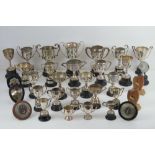 A quantity of thirty-three assorted silver plated engraved trophy cups,
