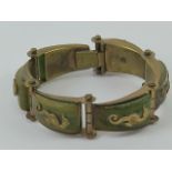 A vintage Jean Painleve Art Deco Seahorse bracelet, having brass motifs on bakelite panels,