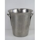 A stainless steel champagne ice bucket or wine cooler, 21cm high.