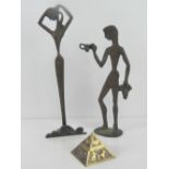 A pair of Greek figurines being male and