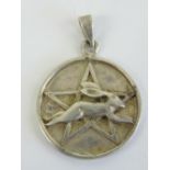 A silver leaping hare and pentagram Wiccan pendant, fertility symbol of Ostara Goddess of Spring,