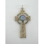 A delightful silver Celtic cross pendant having central opal cabachon, stamped silver, 3.