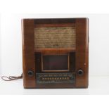 A c1930s vintage Pye radio in half veneered walnut cabinet, 44cm wide, a/f.