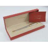 A Dupont ballpoint pen in original box with guarantee dated 1998.