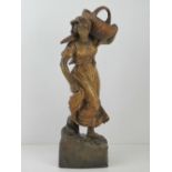 An Austrian Art Nouveau Goldscheider terracotta figuring 'Girl carrying basket' designed by B